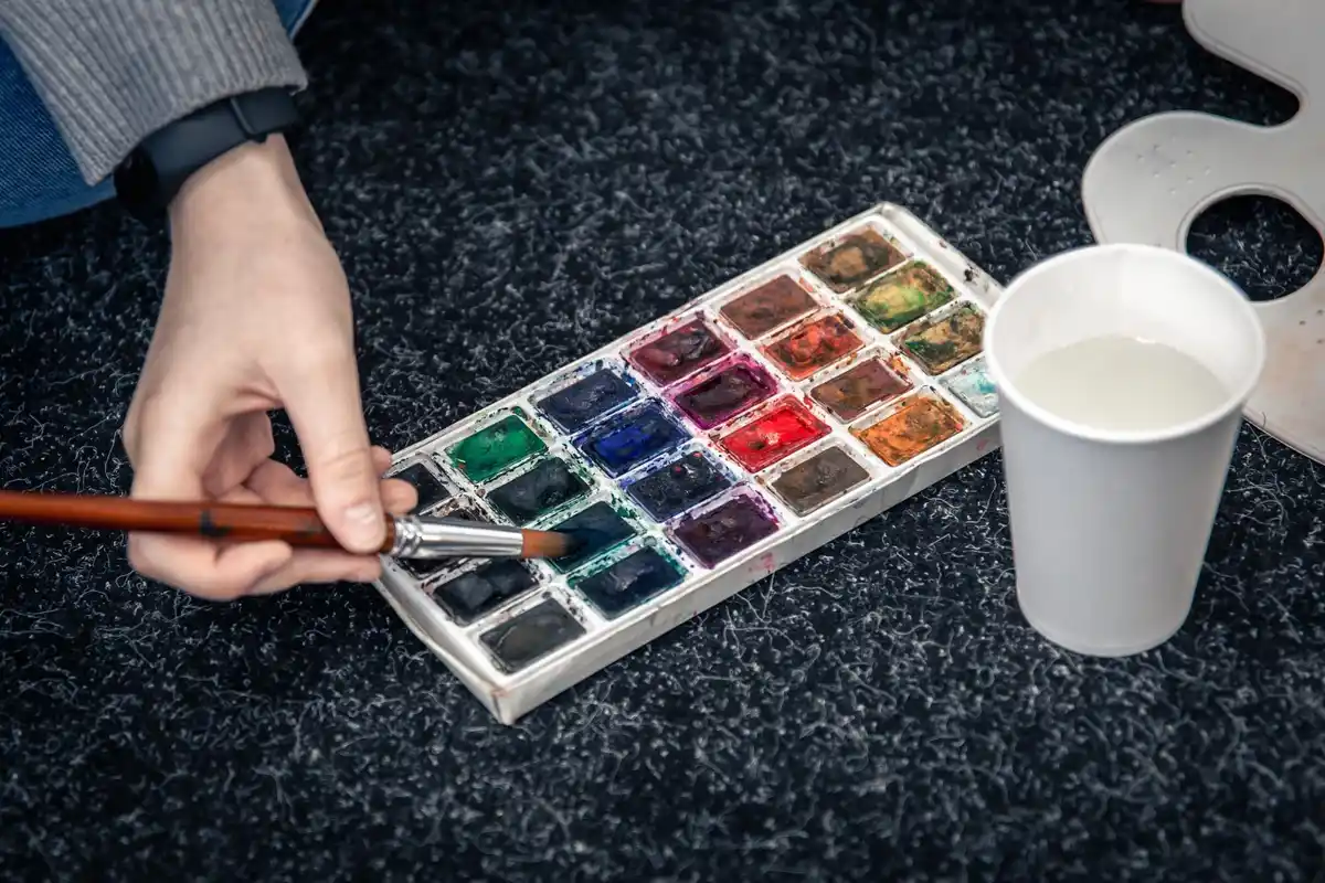 artist palette with watercolor paints and ice cube