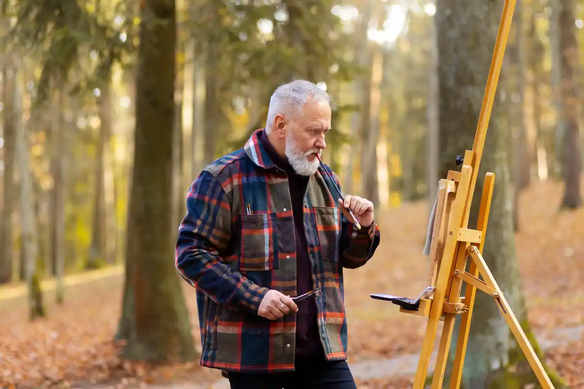 elderly artist working studio paint Prague
