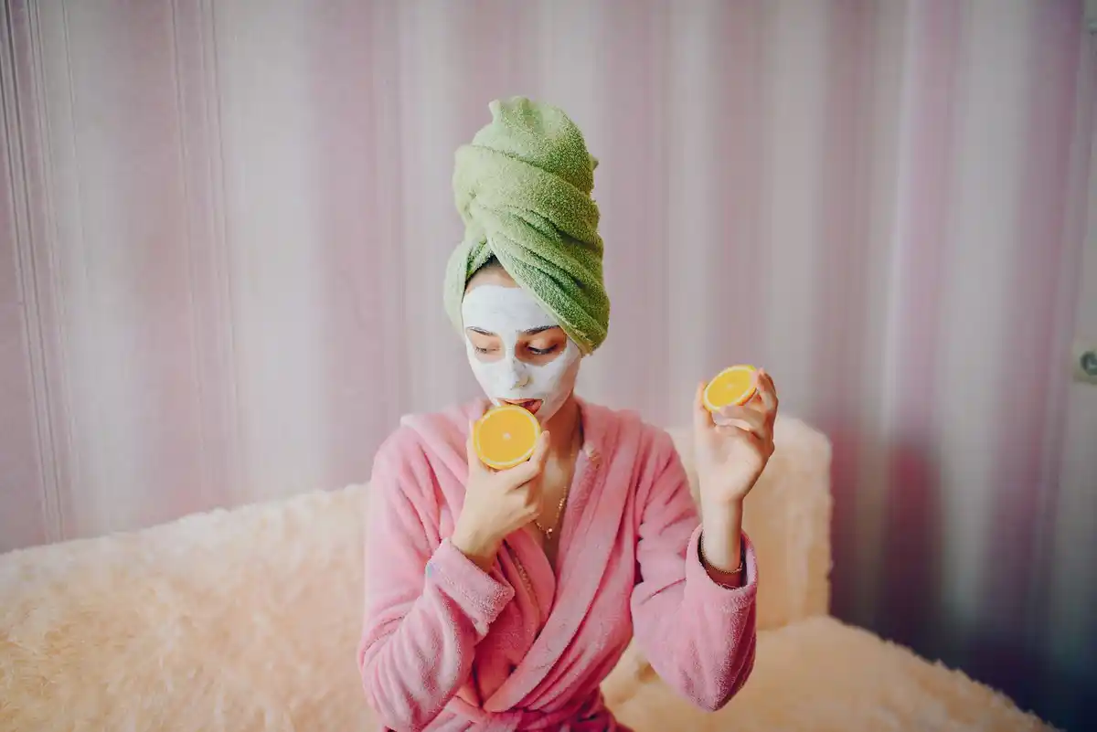 woman applying yogurt face mask, home spa