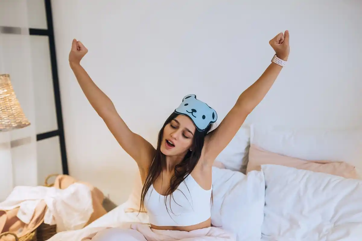 woman waking up with smooth skin after sleep