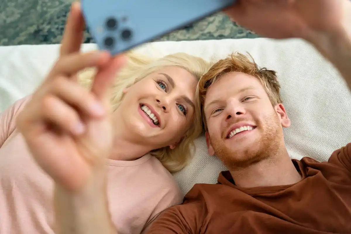 relaxed couple laughing together without phones, natural lighting