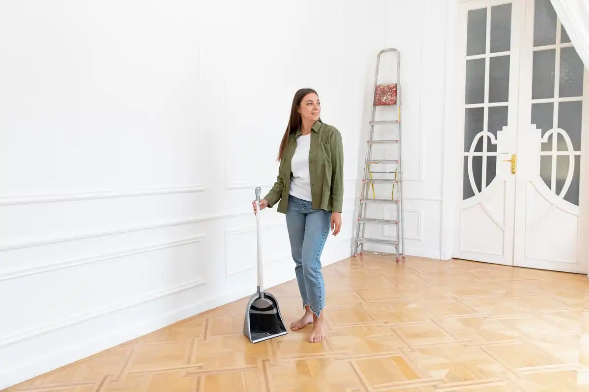 elderly japanese woman cleaning living room minimalism