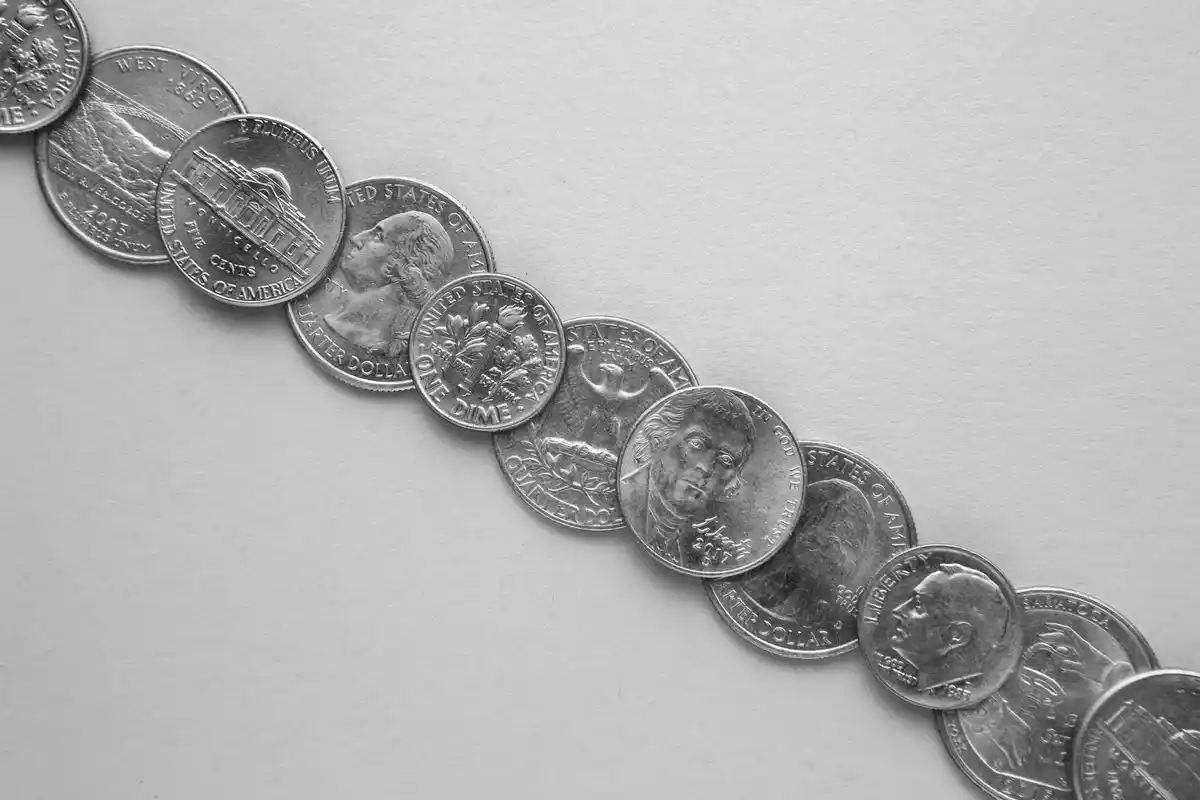 Czech coins scattered on wooden table