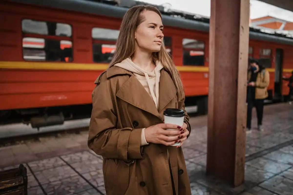 young woman confused in empty tram in Prague at night