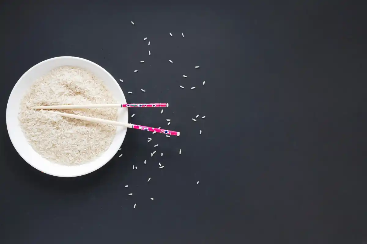 wet smartphone in rice flatlay