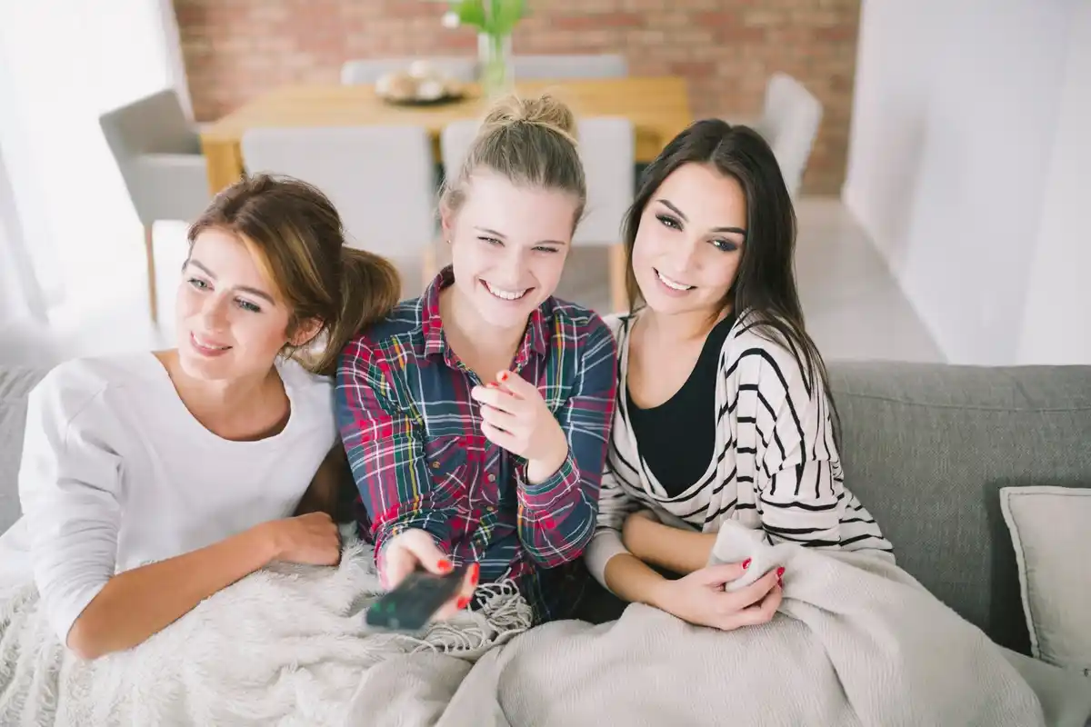 family using smart tv for video call and photo sharing in prague home
