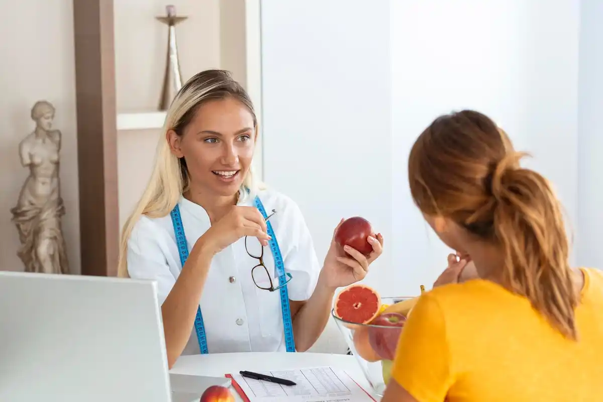 doctor showing cholesterol test results
