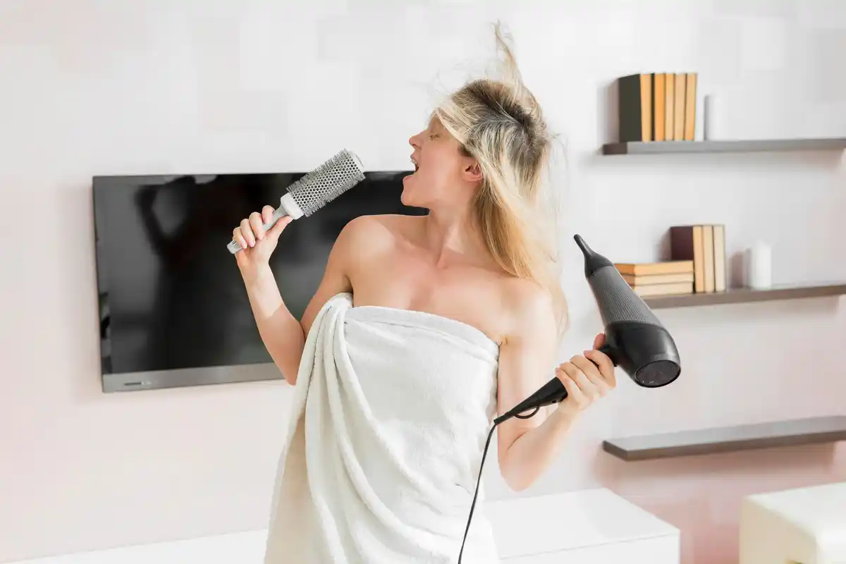hair dryer wet hair damage woman close-up morning