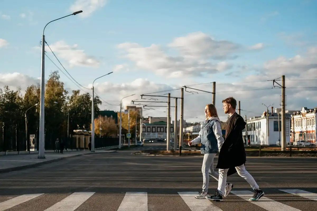 active people walking pavement sunset city