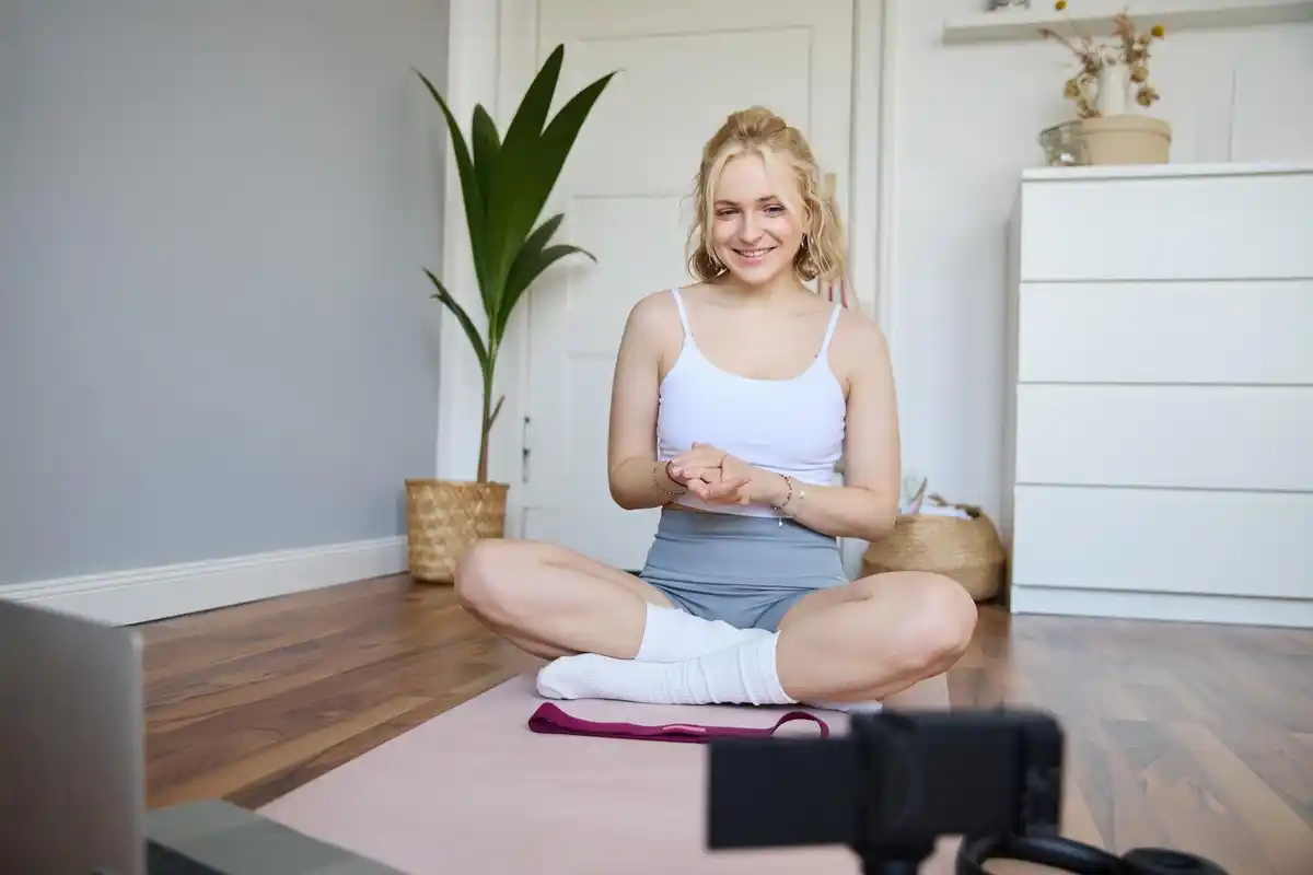 Czech mature woman exercising at home living room natural light