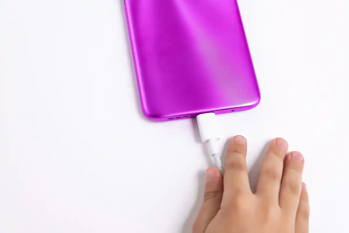 phone charger plugged into wall czech home