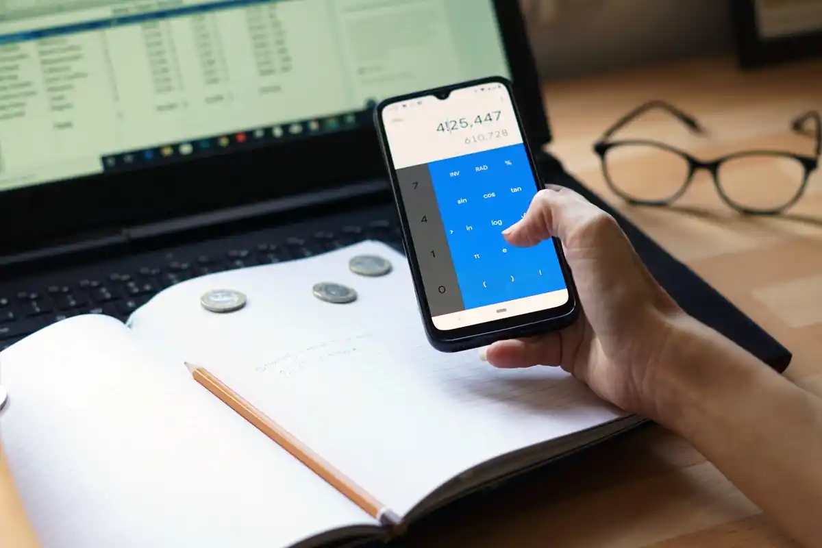 Czech savings app, phone screen, coins, modern financial management