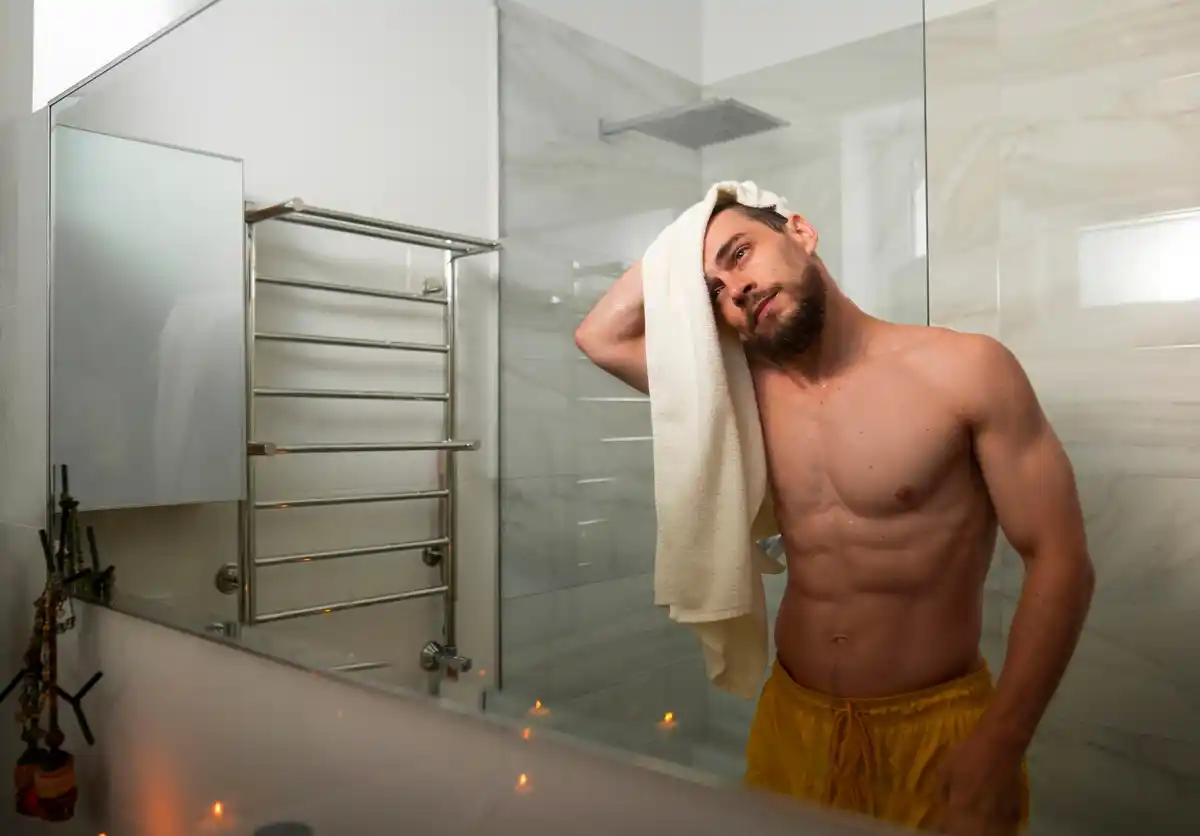cold shower routine young man bathroom morning
