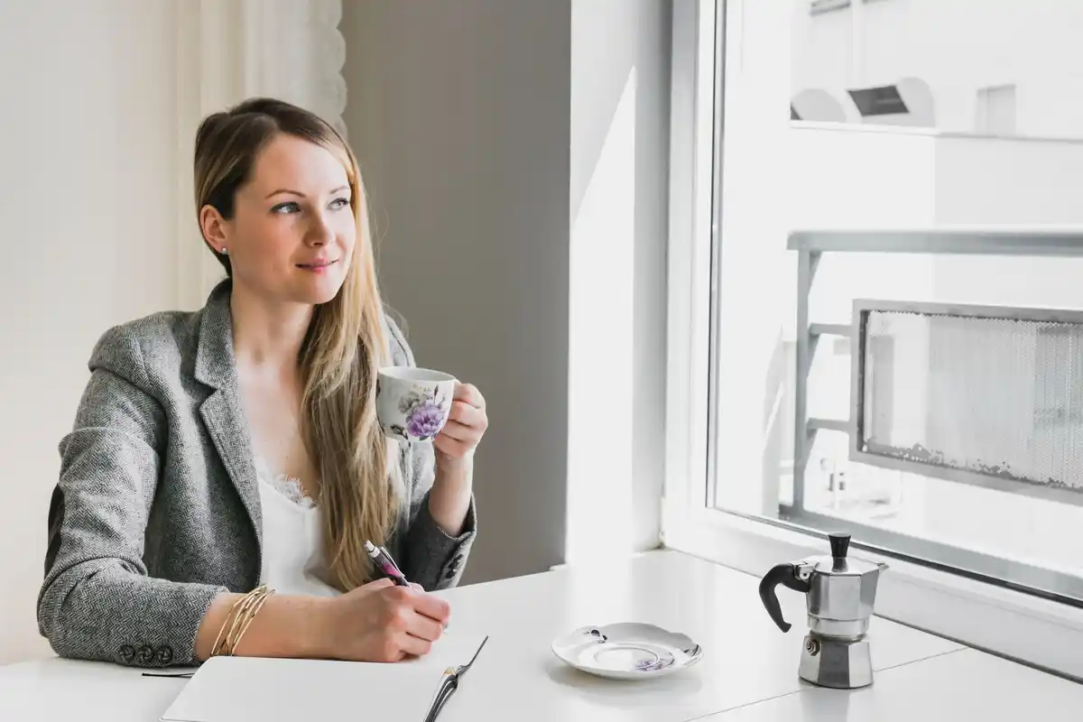 Czech office worker refreshing face cold water