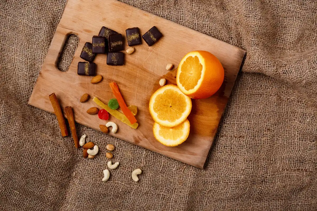 Nuts, dark chocolate, orange office snack table Prague