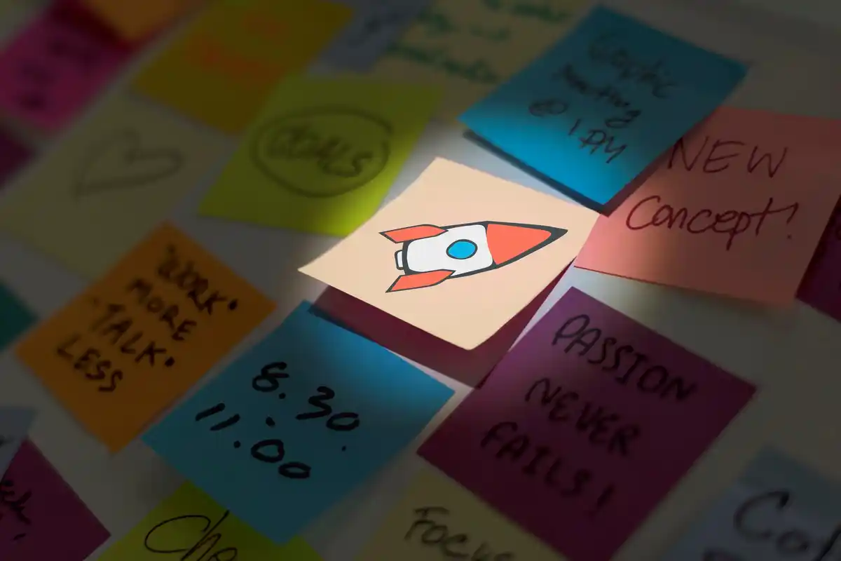handwritten micro goals on sticky notes czech workspace