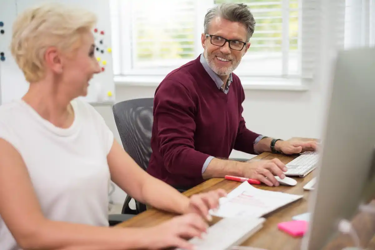 experienced worker modern office Czech senior team