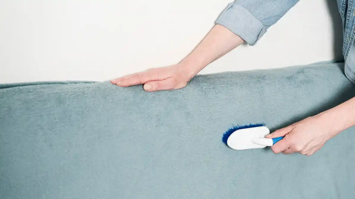 sock dusting furniture hand close up