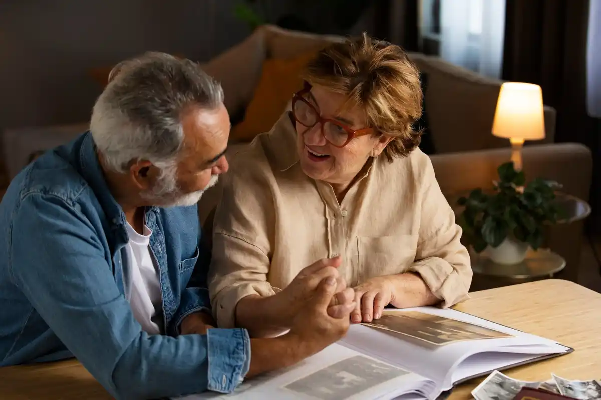 elderly czech couple budgeting at home