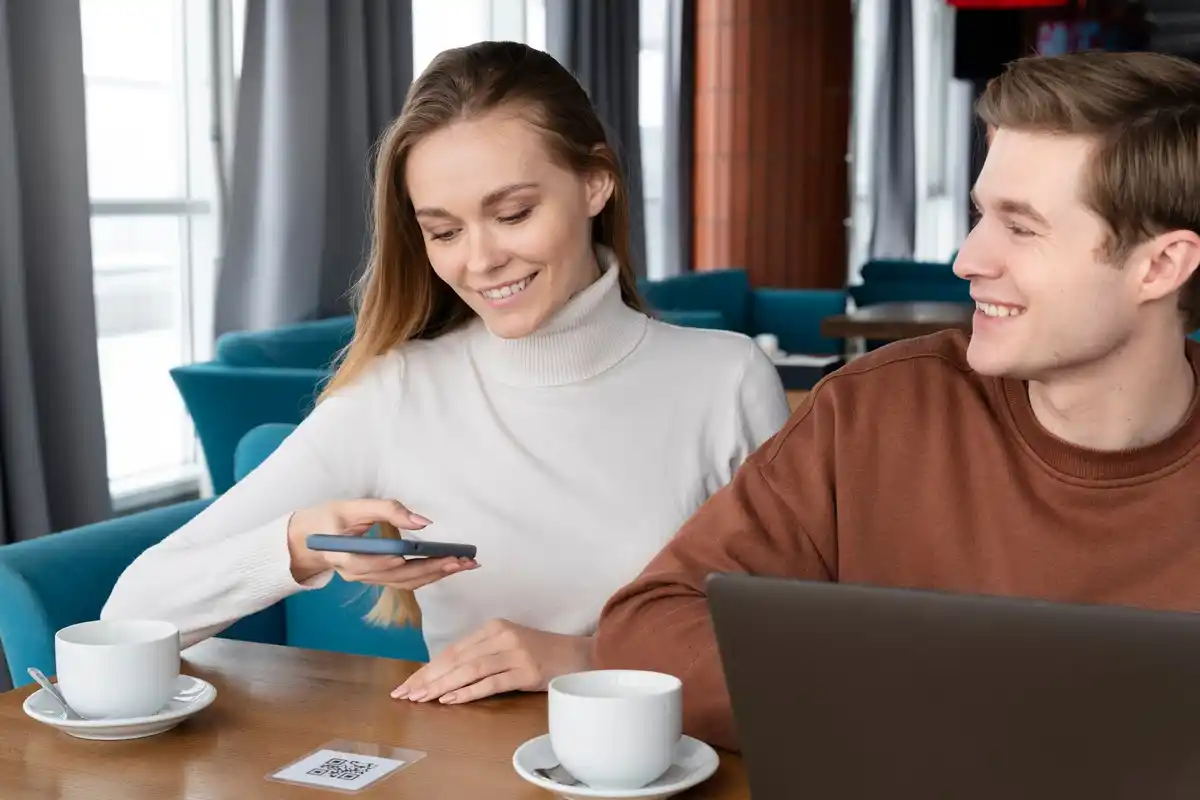 czech people paying with mobile app in cafe