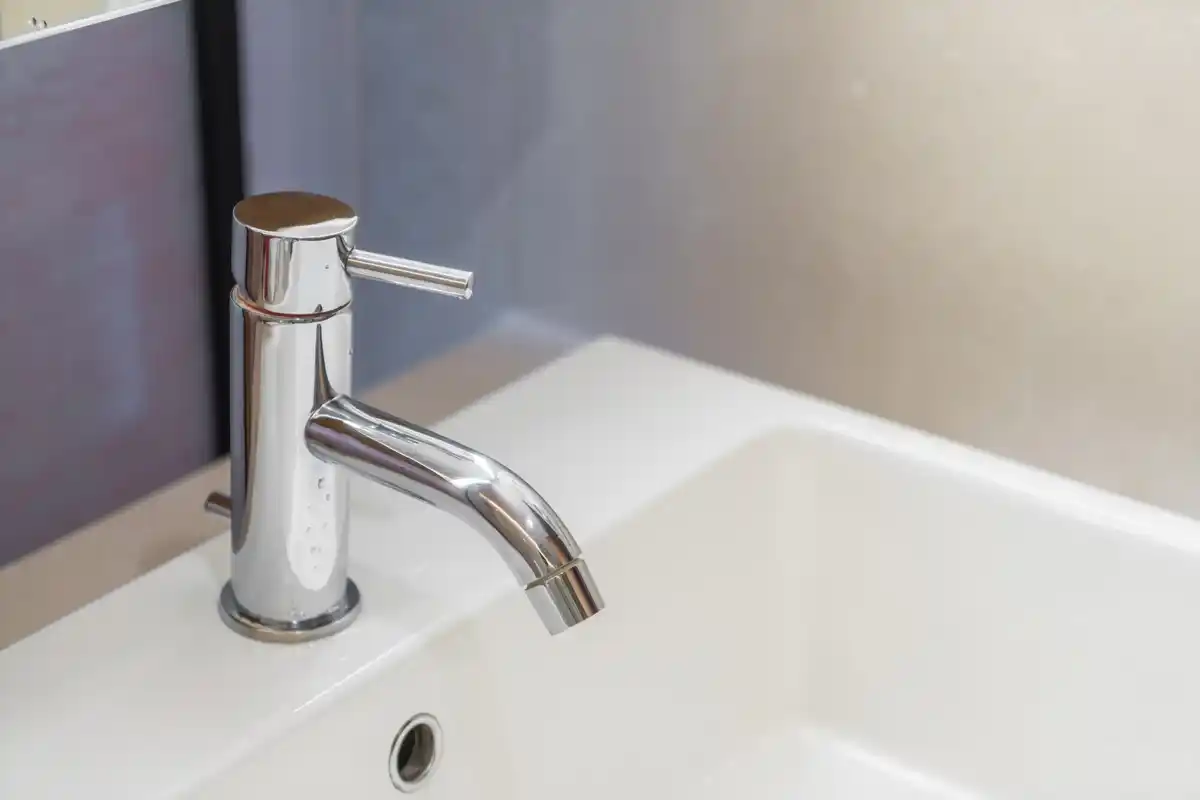 limescale buildup Czech bathroom faucet close up