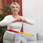 elderly woman cleaning Czech home with back pain prevention