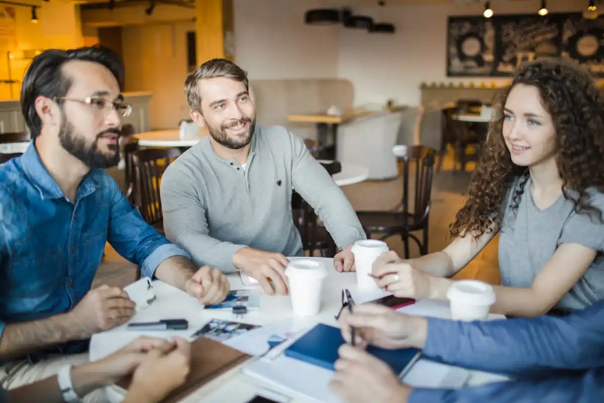 czech coworkers having casual conversation office