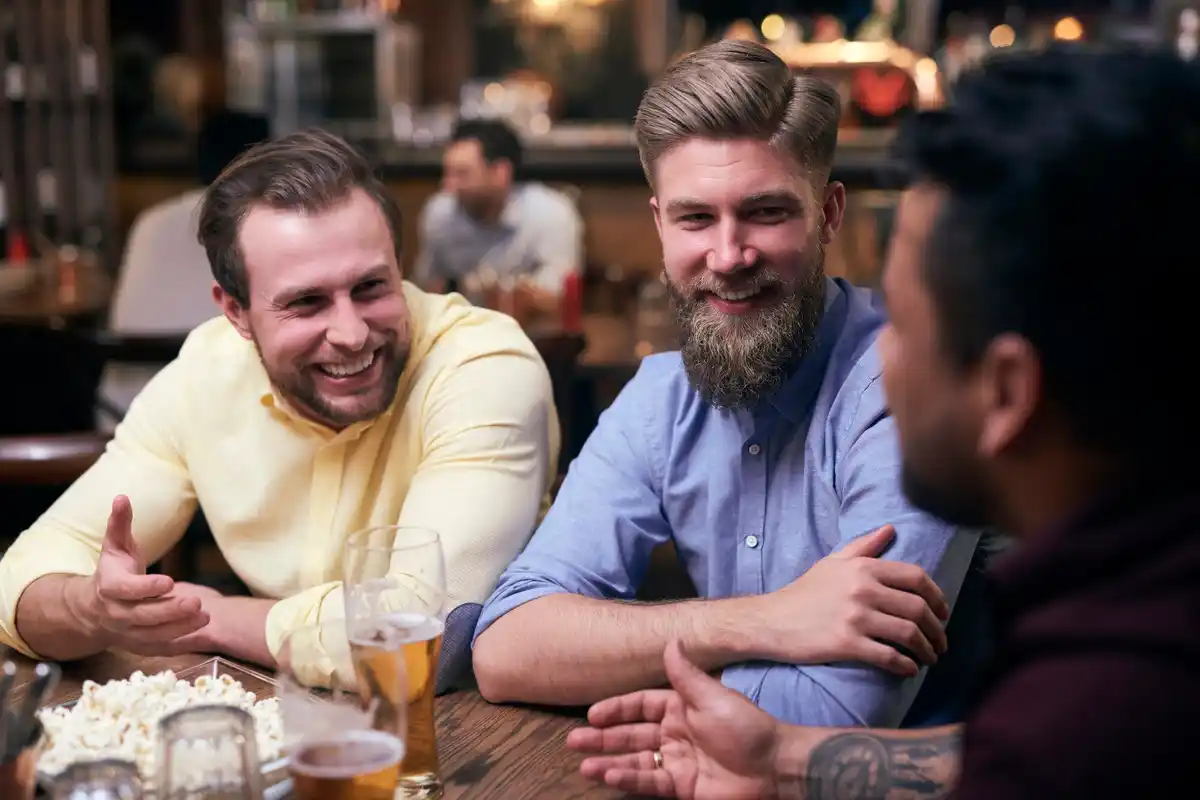 friends arguing czech pub