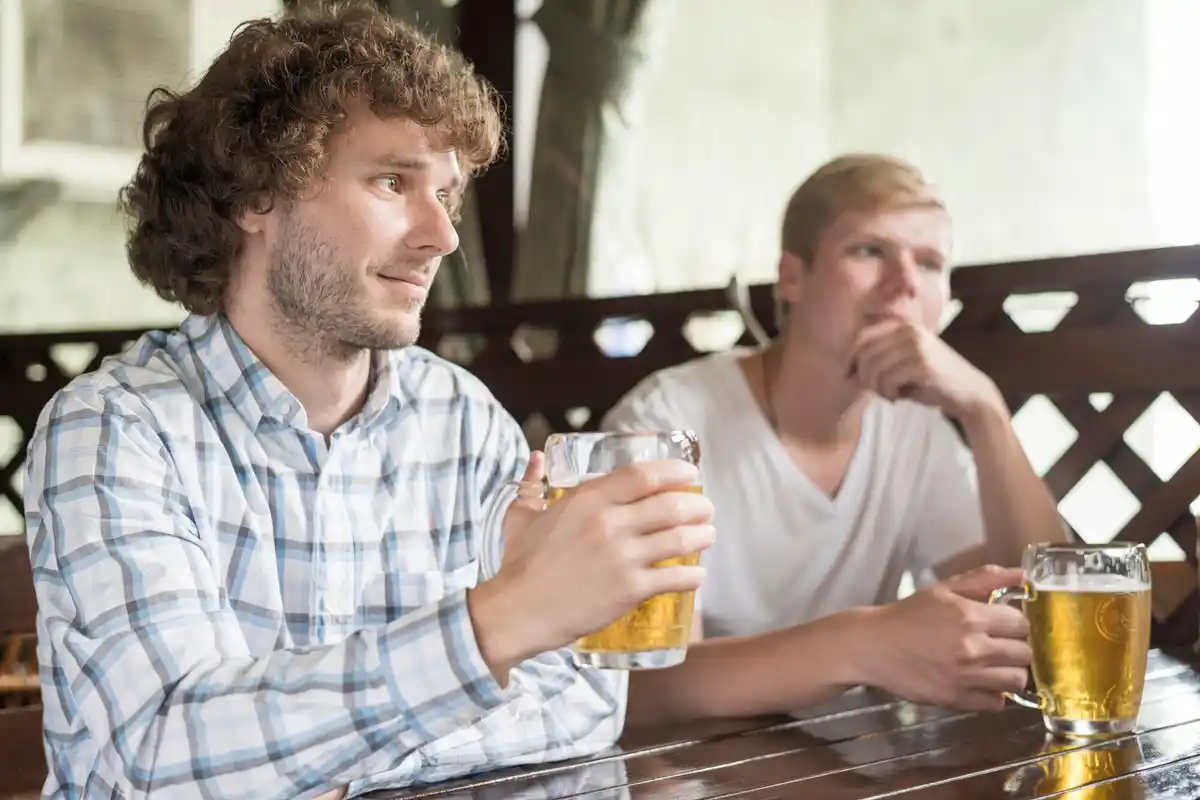 upset friends arguing in czech pub