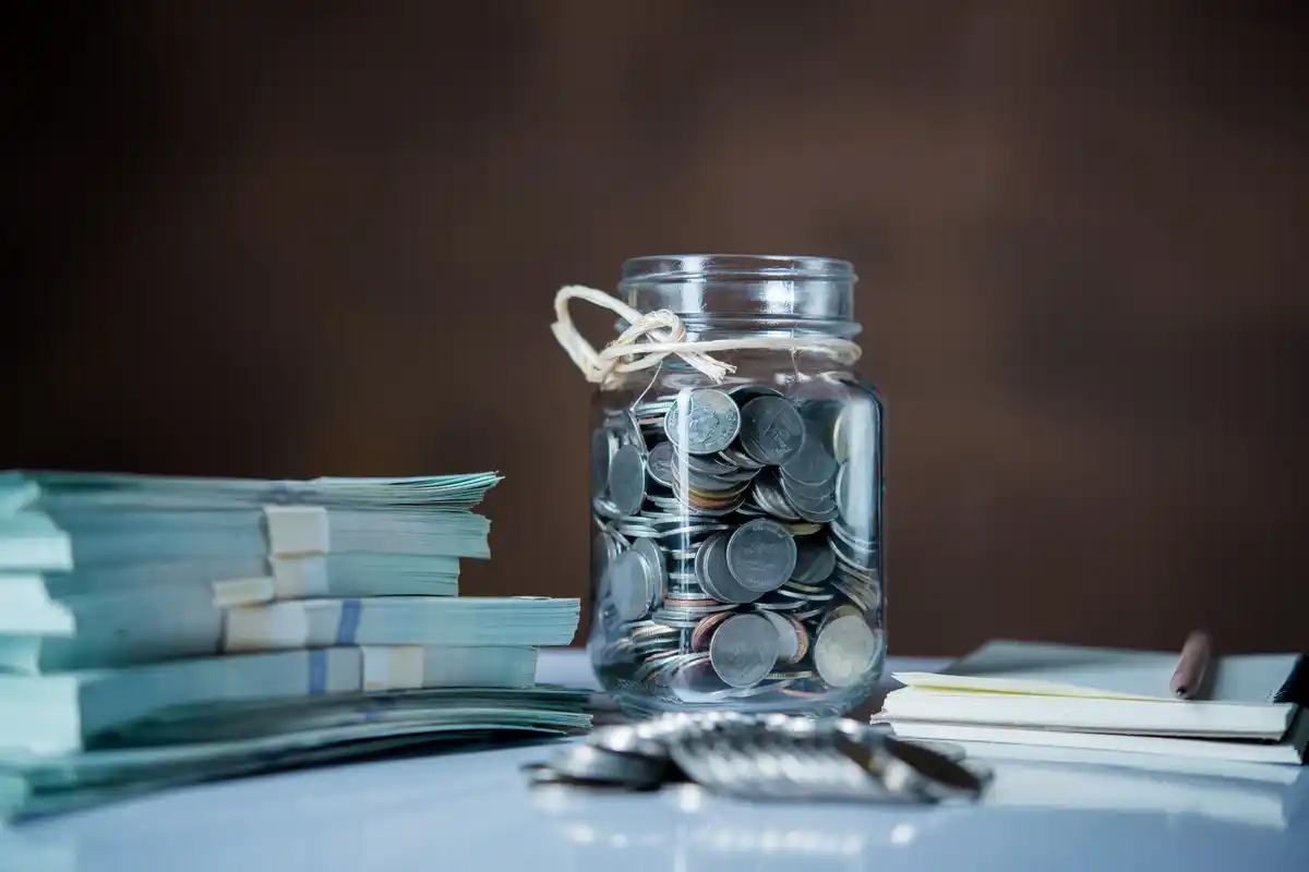 Czech coins in a jar on a home kitchen table