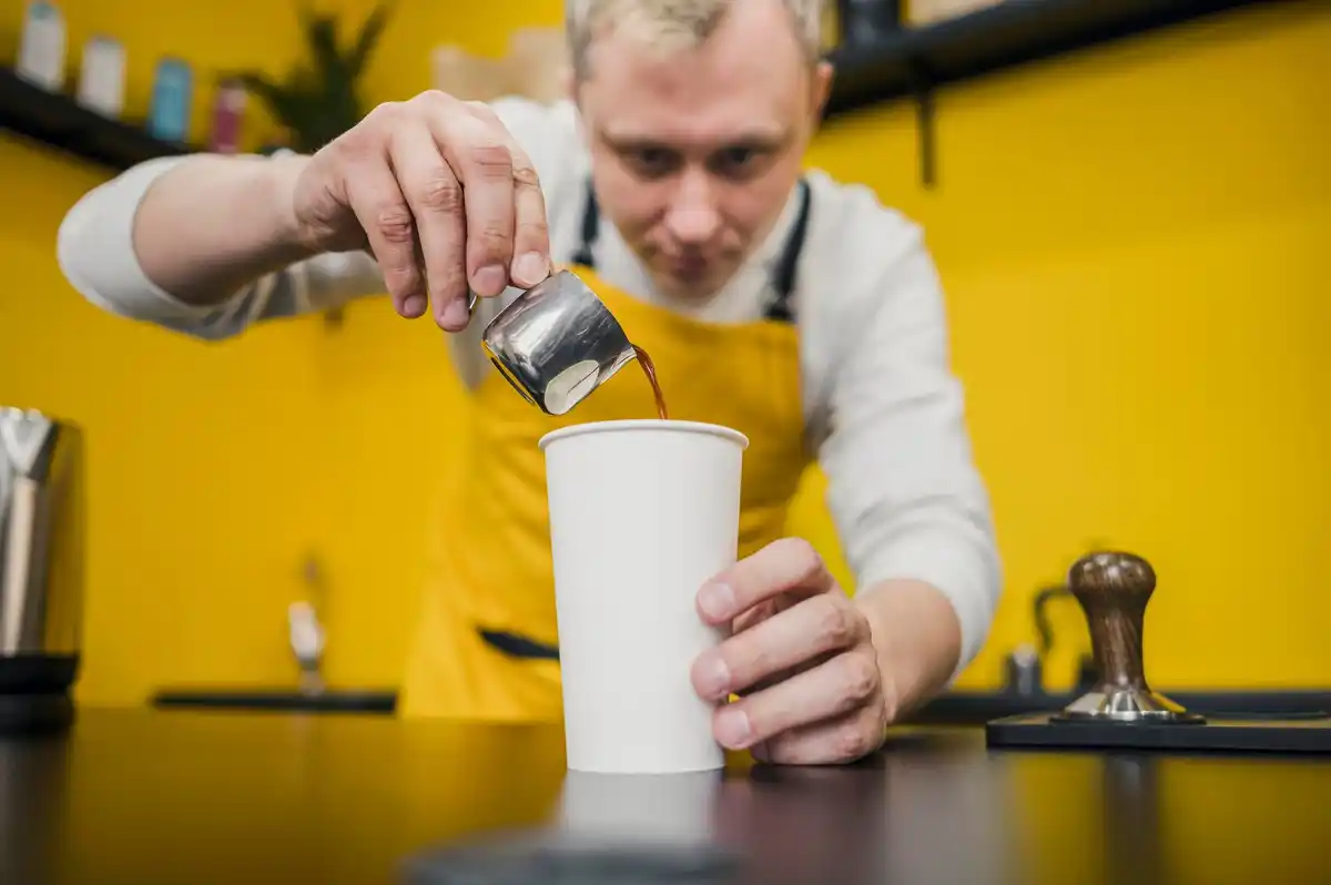 barista adding salt to coffee