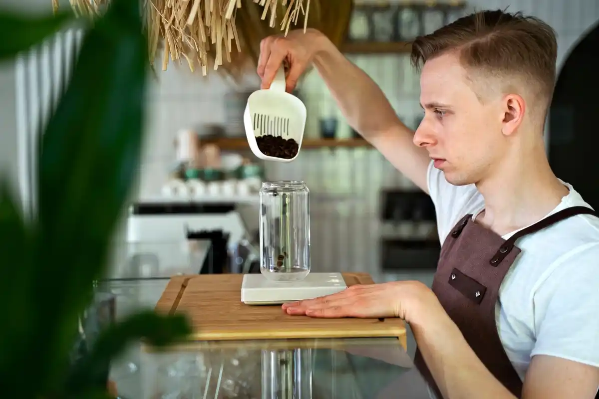 barista adding salt to coffee in czech cafe