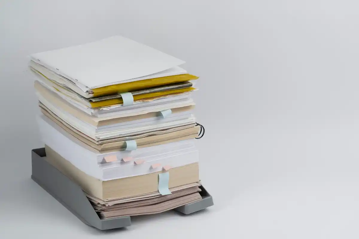 stack of faded supermarket receipts on table