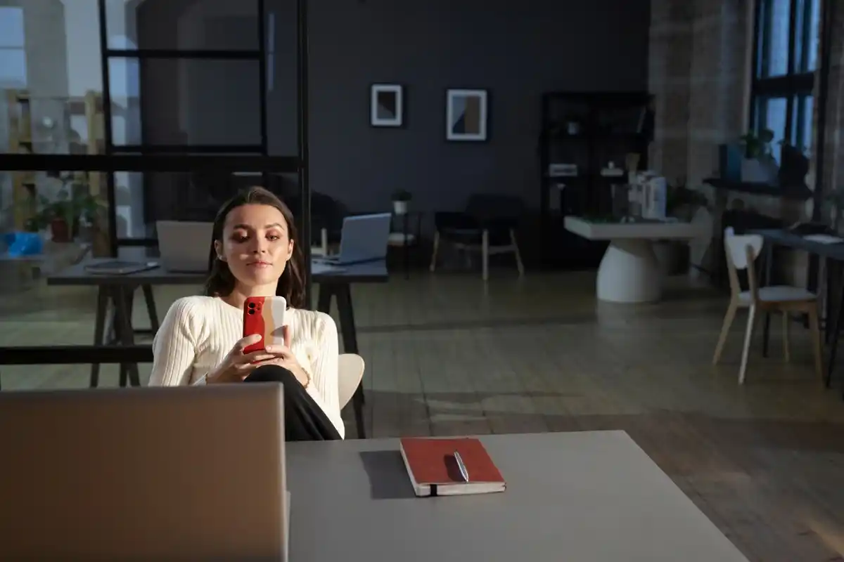 young Czech professionals taking break by window office daylight mindfulness