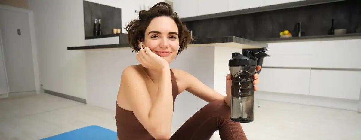 person drinking water after workout czech fitness