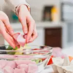 frozen raw meat defrosting in water bowl kitchen