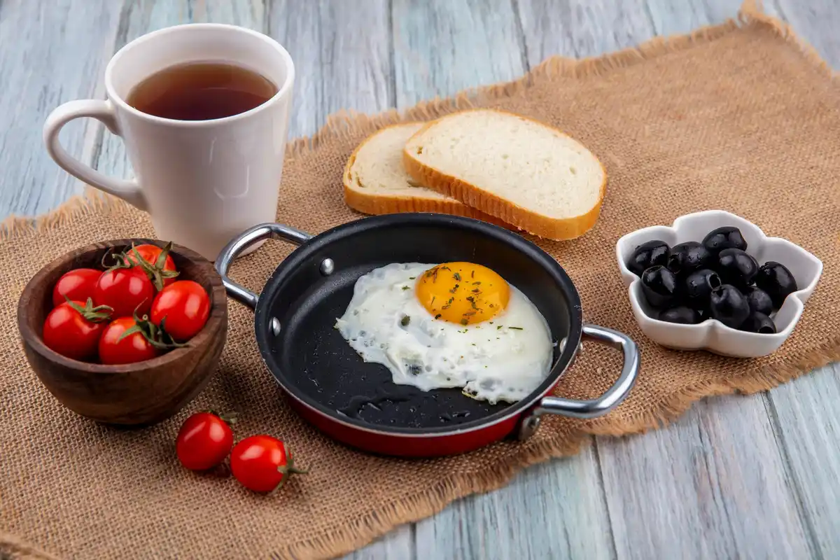 boiled egg with cracked shell in pot