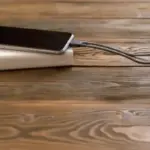 damaged phone battery close up charging cable night