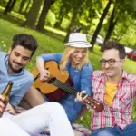 young people listening to music together outdoors czechia