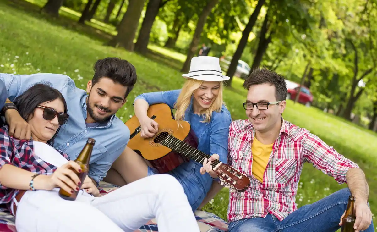 young people listening to music together outdoors czechia