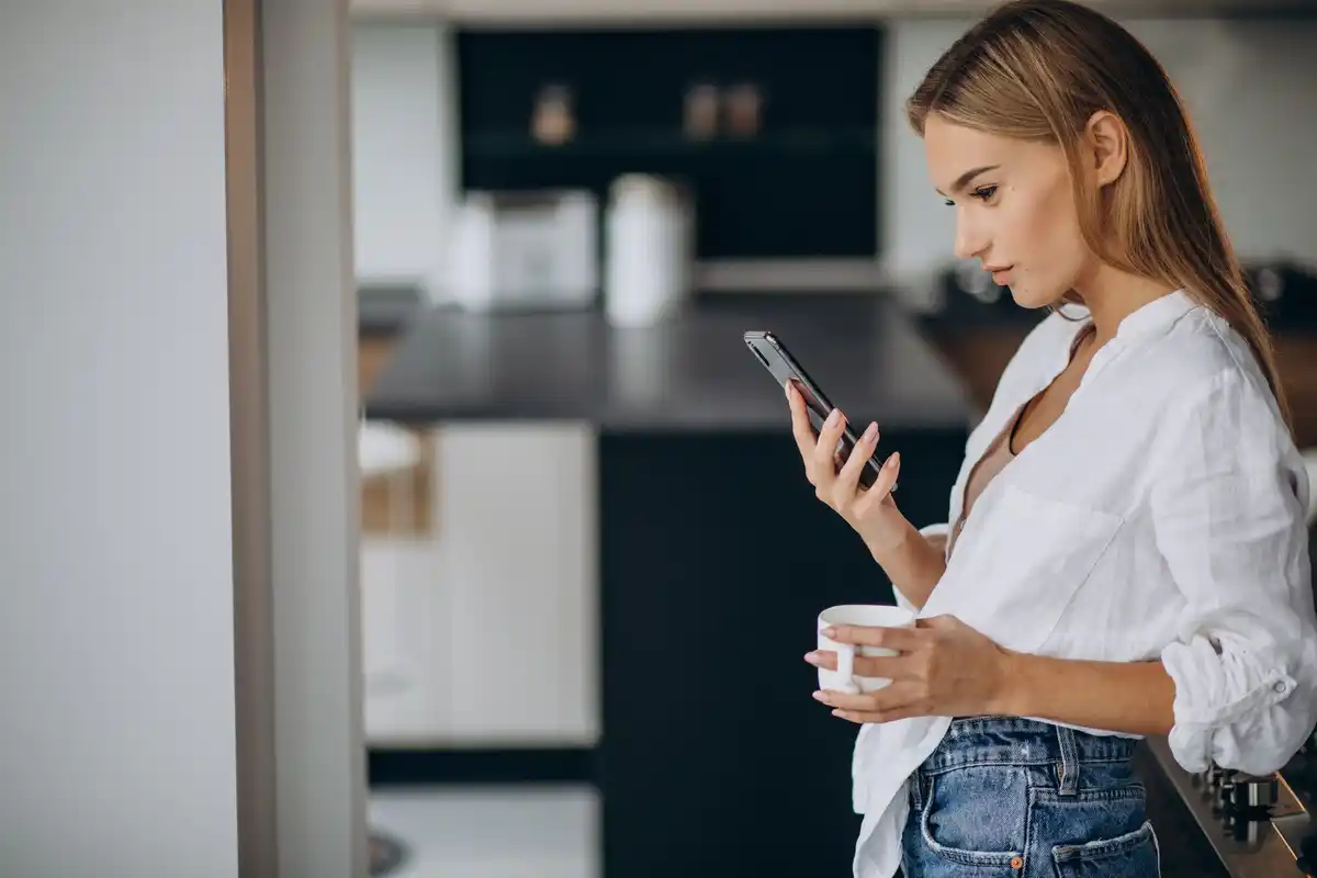 woman turning off unused smartphone features settings