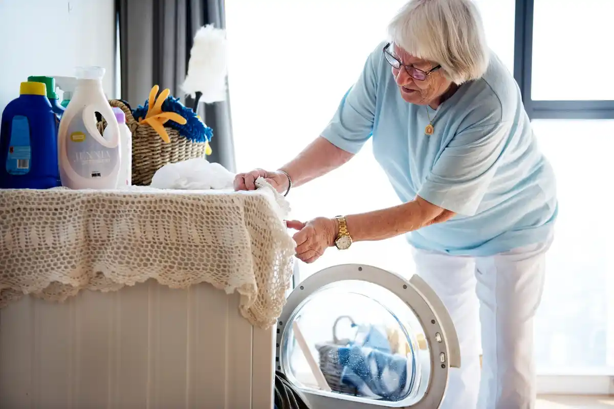 czech senior woman cleaning home