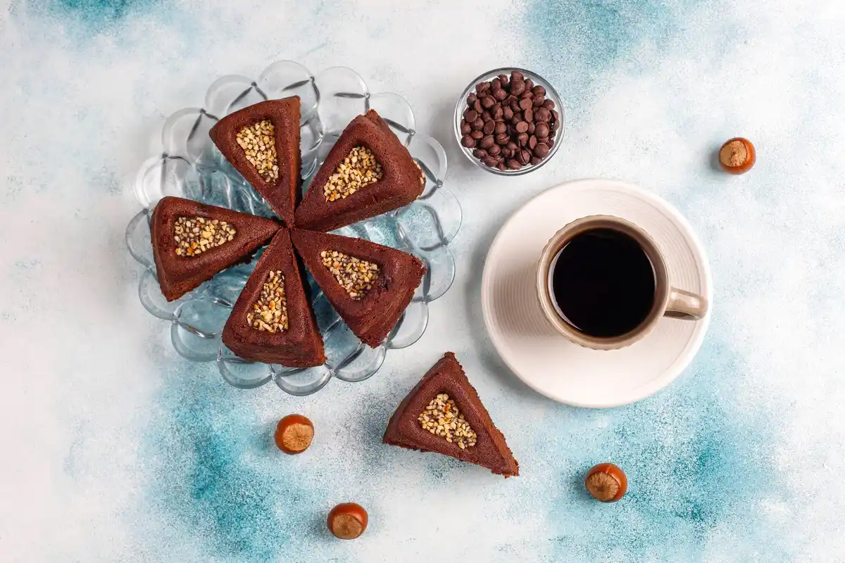 cake with coffee grounds slice on table