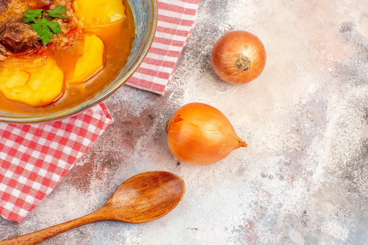 homemade broth with onion peels rustic kitchen