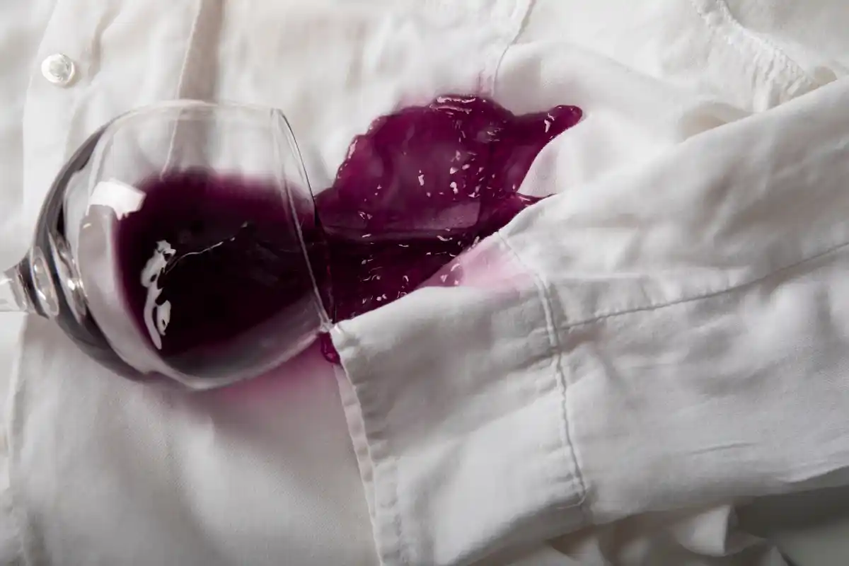 pouring baking soda on wine stain fabric