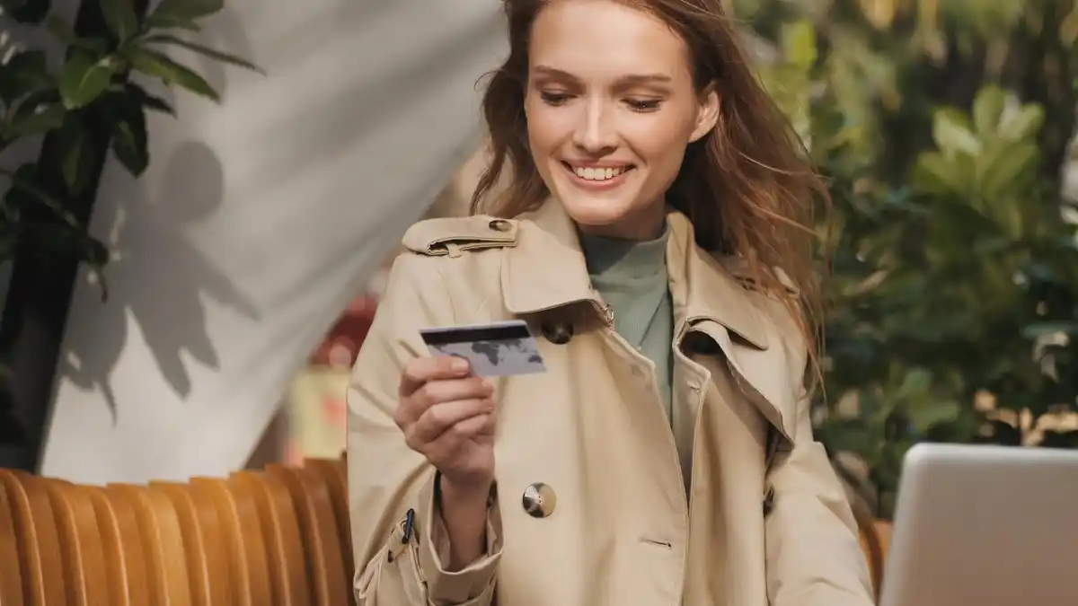young traveller paying by card abroad czech modern