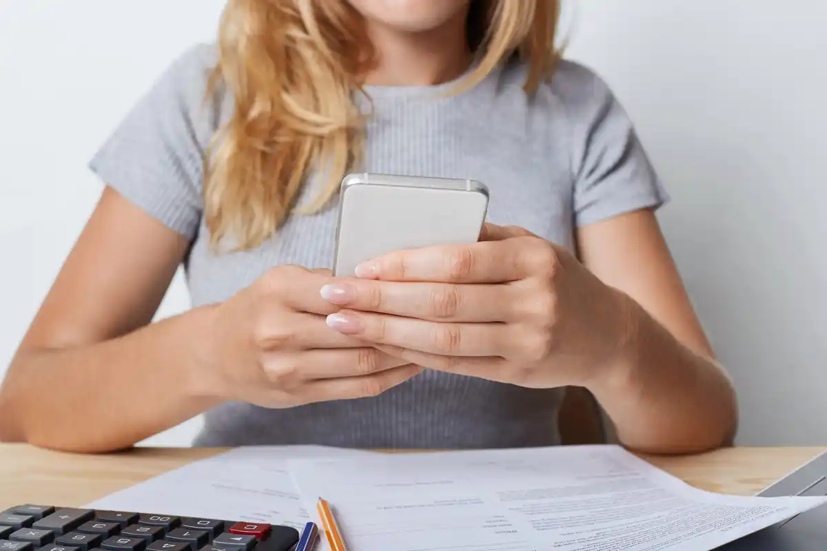 person scanning czech receipts with smartphone for digital archive