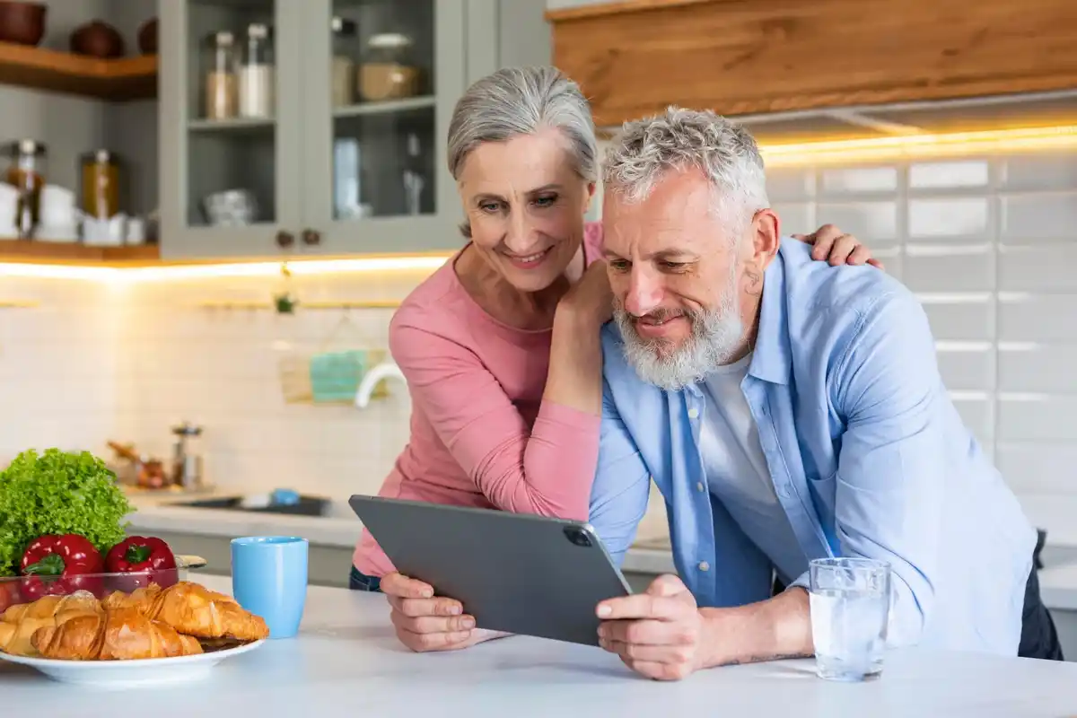elderly czech couple saving money at home