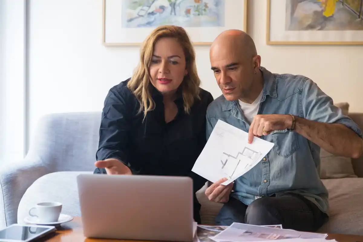 middle aged czech couple managing personal finance
