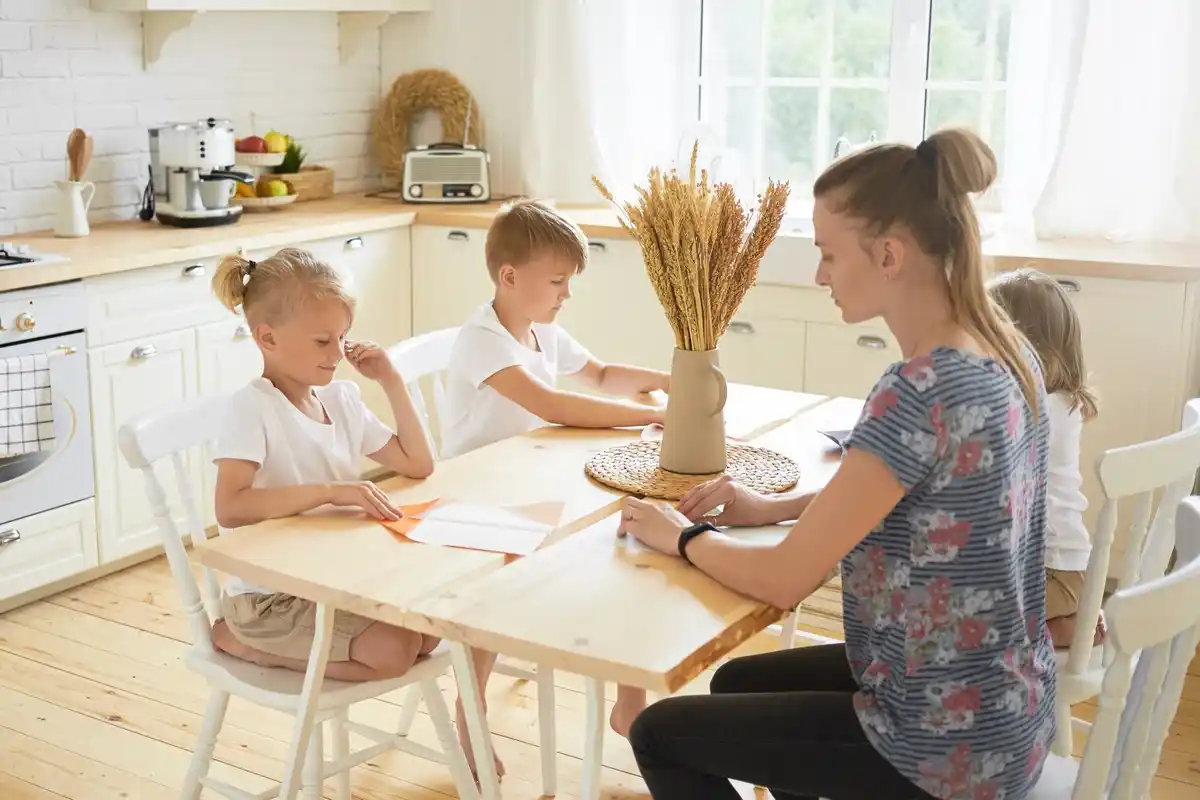 czech family checking bills at kitchen table
